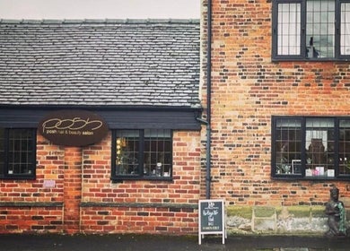 Exterior of Posh Nail and Beauty in Aston-on-trent, England showcasing vintage brickwork and inviting signage.