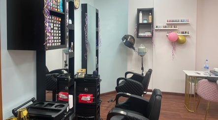 Sophisticated styling stations at Royal Amber lady salon, Dubai, Dubai, AE, featuring chairs and decor.