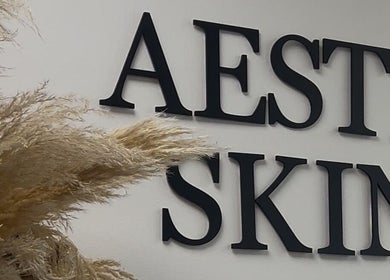 Aesthetic SKIN signage decor at By Lottie Grace, Margate, England, GB with pampas grass.