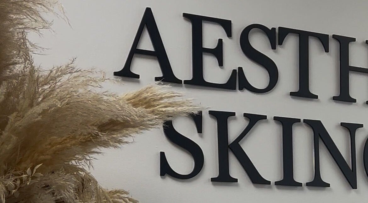 Aesthetic SKIN signage decor at By Lottie Grace, Margate, England, GB with pampas grass.