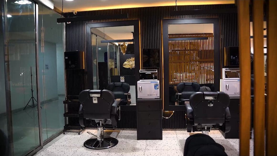 Modern salon interior at Mufasxclusivetouch, Abuja, Federal Capital Territory, NG showcasing luxury styling chairs.