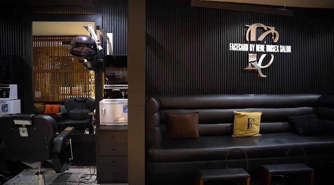 Modern salon interior with sleek black seating at Mufasxclusivetouch, Abuja, Federal Capital Territory, NG.