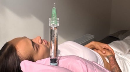 Relaxed patient during dermal filler treatment at WZAesthetics London, located in London, England, GB.