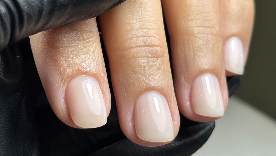 Manicured nails with a glossy finish at Karas Beauty Hub in Montreal, Canada, CA.