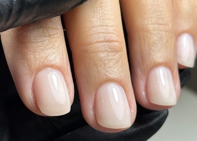 Manicured nails with a glossy finish at Karas Beauty Hub in Montreal, Canada, CA.