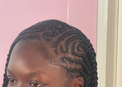 Intricate braided hairstyle at Tees Hair Affair, Saint John's, Saint John, AG showcasing stylish craftsmanship.