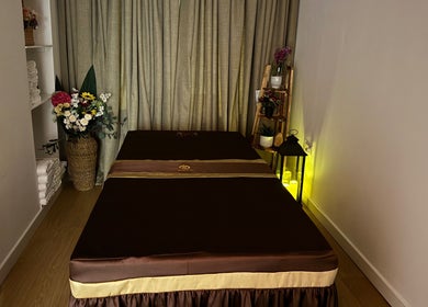 Tranquil massage room at Ve La Dee Thai Spa, Manchester, England, GB, featuring a plush table and elegant decor.
