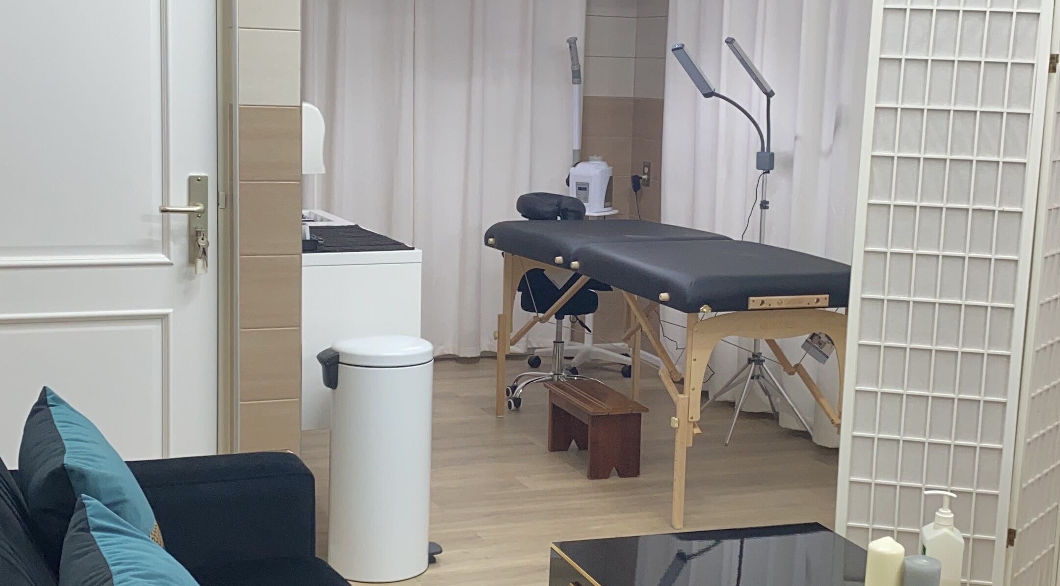Elegant treatment room at The Salon, Paramaribo, Paramaribo, SR with massage table and ambient lighting.