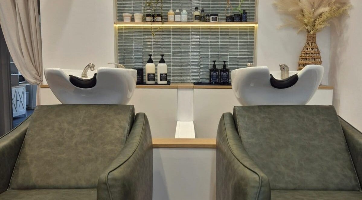 Elegant wash stations at The Studio by Laurine Durand in Camp Hill, Queensland, AU with modern decor.