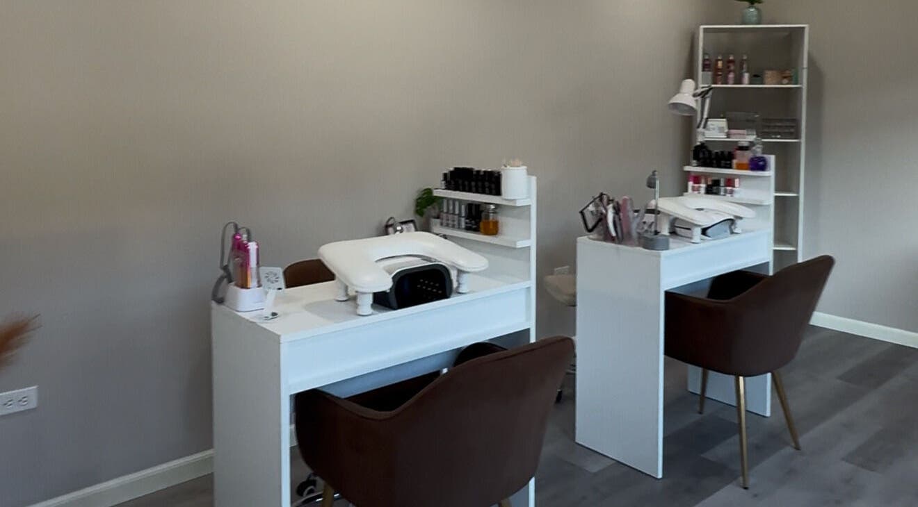 Modern manicure stations at AMOURA Nails Spa, Ensenada, Baja California, MX, showcasing sleek and professional setups.