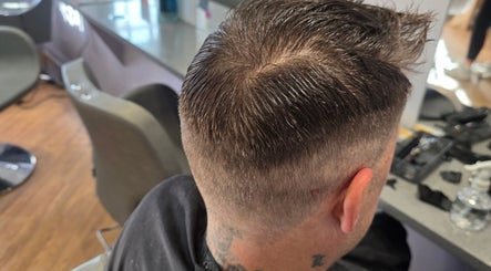 Modern haircut at Kourtneys Lovely Locks, Newbury, England, GB. Perfectly groomed for a polished look.