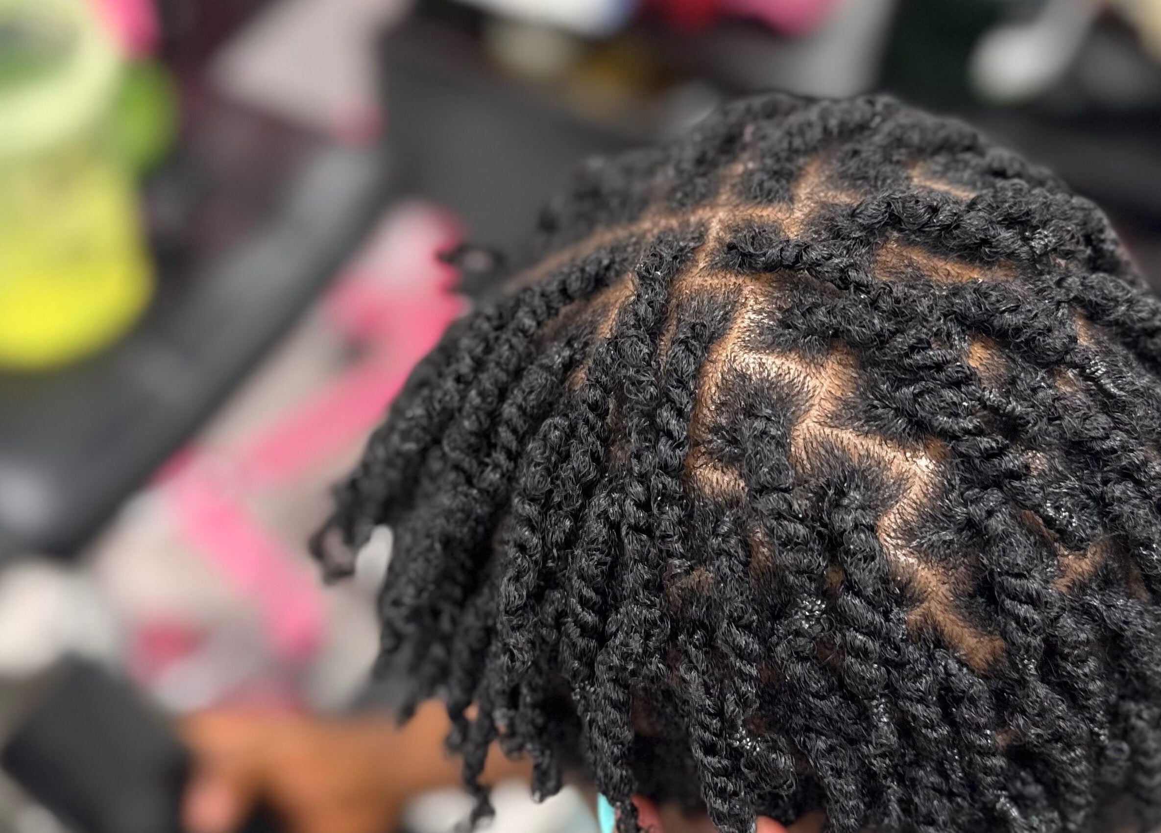 Intricate braided hairstyle at Funmi's, New York, New York, US, showcasing expert styling.