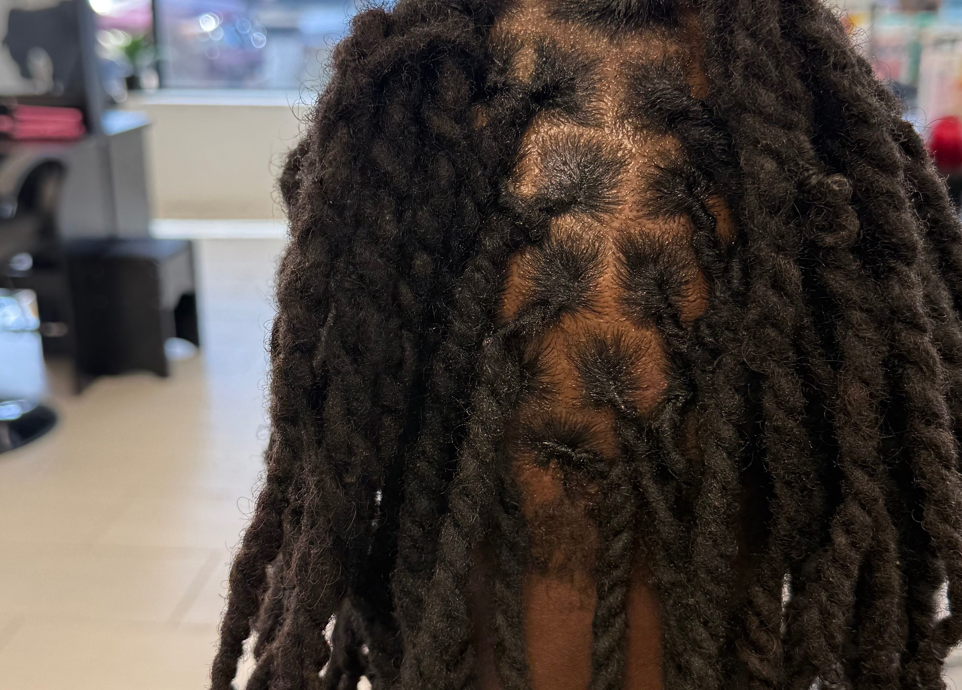 Close-up of professionally styled locs at Funmi’s, New York, New York, US.