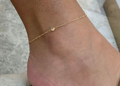 Close-up of a gold anklet on ankle, LINKED (Mobile Home Appointments UAE), Dubai, AE.