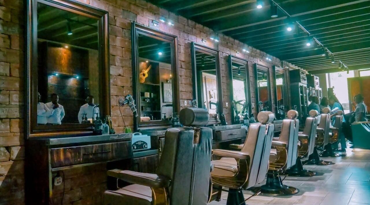 Interior of Cuttingedge Barbershop in Lusaka, Lusaka Province, ZM with modern barber chairs and mirrors.