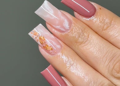 Elegant nail art with gold flakes from Amhnailz in Las Vegas, Nevada, US.