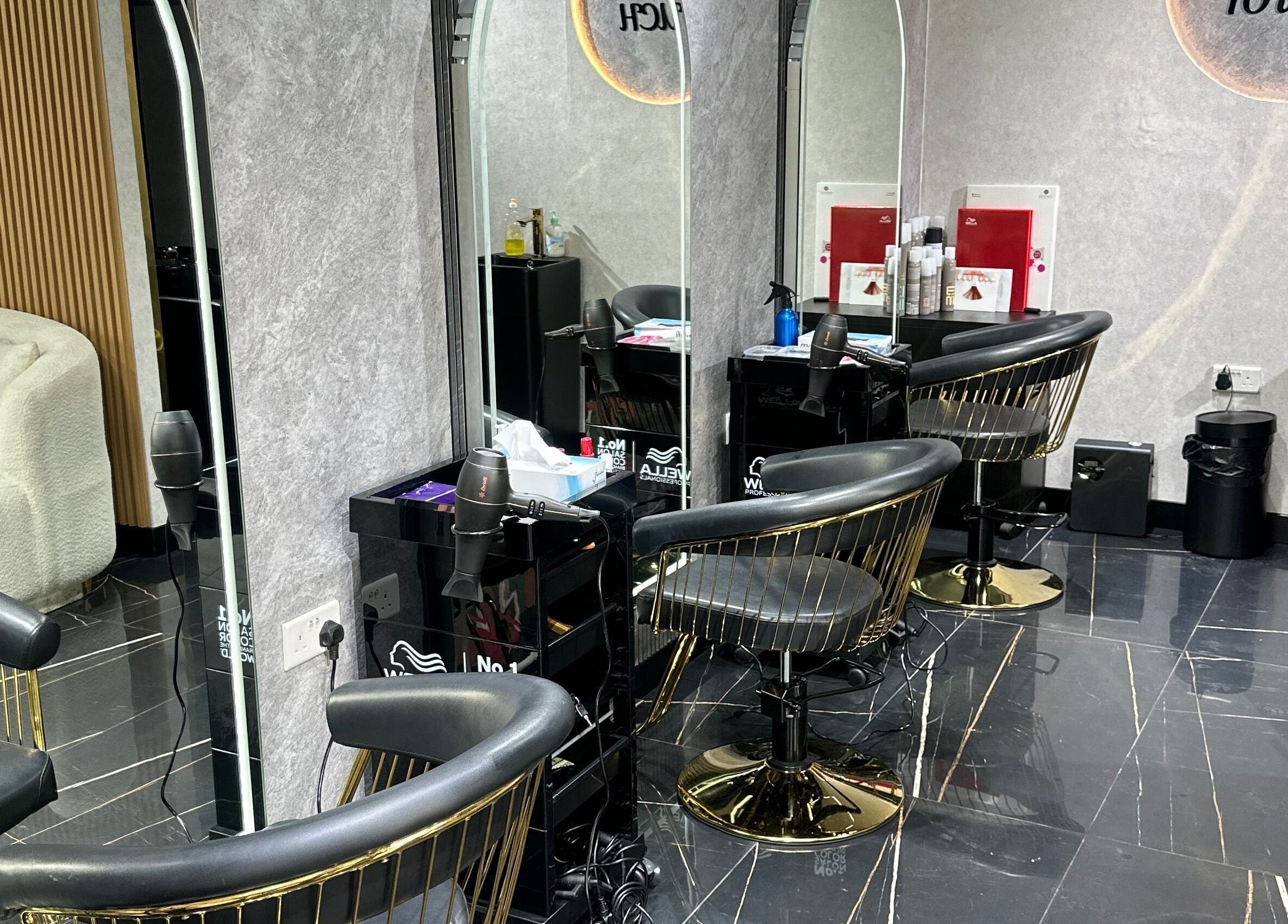 Modern salon interior at Luxury Touch Beauty Salon in Dubai, Dubai, AE, featuring stylish black chairs and decor.