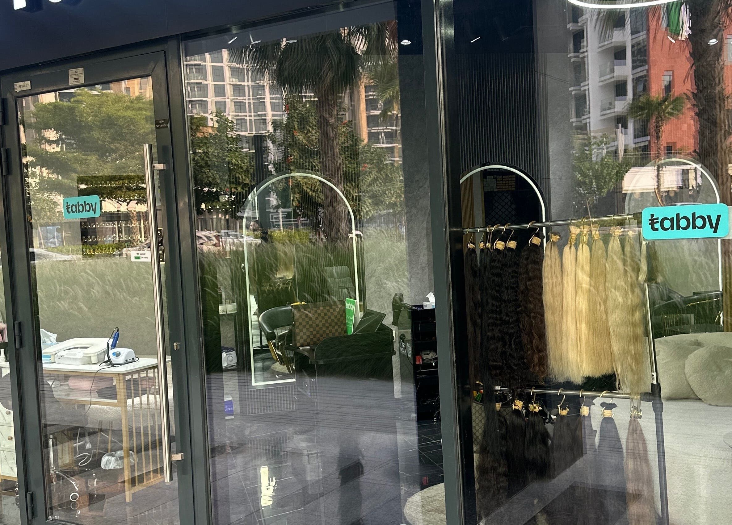 Luxury Touch Beauty Salon entrance with chic decor and hair products in Dubai, Dubai, AE.