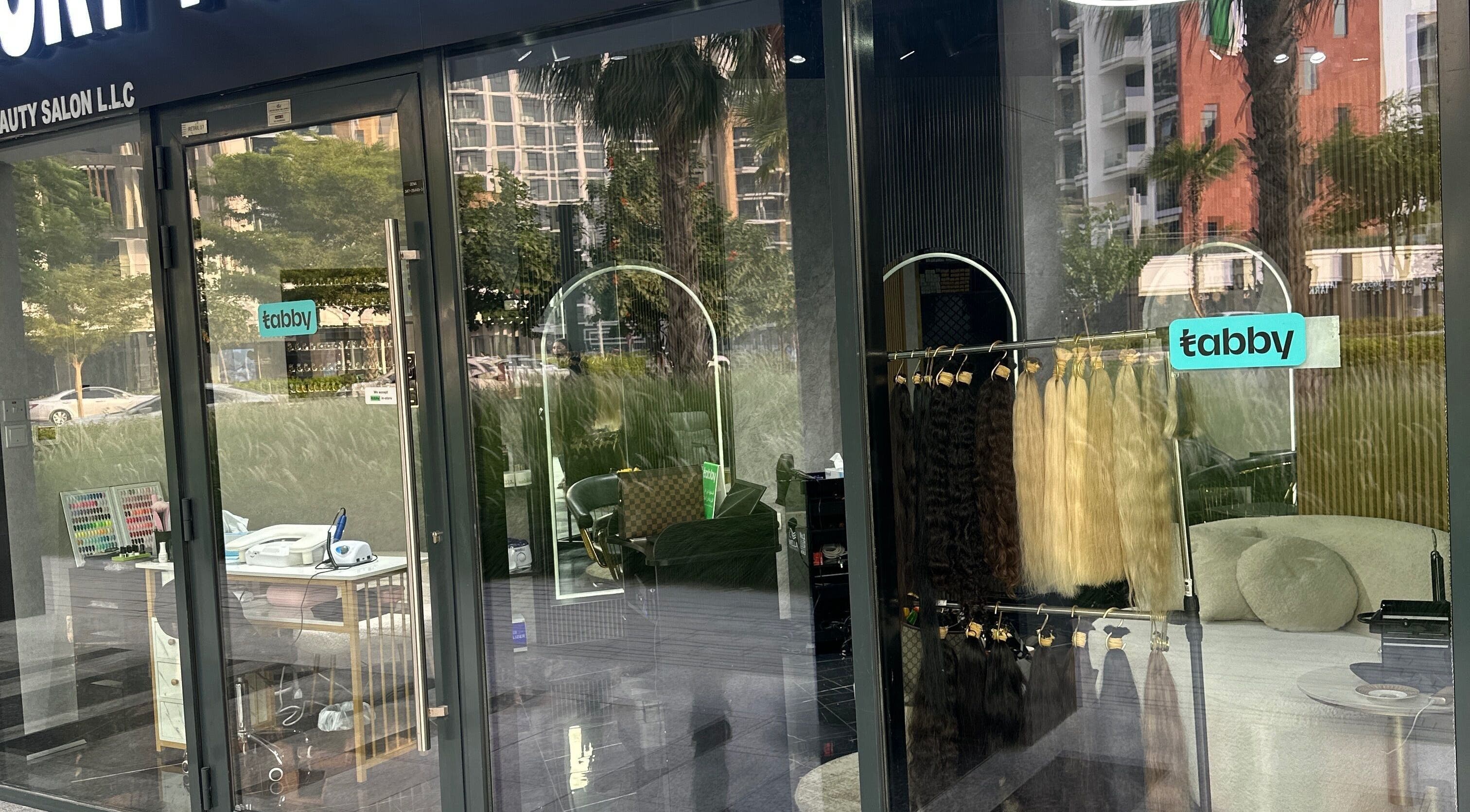 Luxury Touch Beauty Salon entrance with chic decor and hair products in Dubai, Dubai, AE.