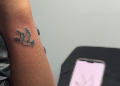 Detailed bird tattoo on wrist done at De Effys Effectttt, Ilford, England, GB. A testament to skilled artistry.
