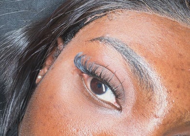 Close-up of eyelash extensions at De Effys Effectttt, Ilford, England, GB, showcasing detailed lash work.