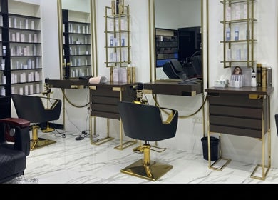 Luxurious styling stations at Glam & Go Ladies Salon L.L.C, Dubai, Dubai, AE, with gold accents and chic design.