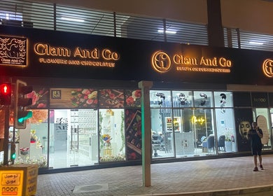 Illuminated facade of Glam & Go Ladies Salon L.L.C in Dubai, Dubai, AE at night.