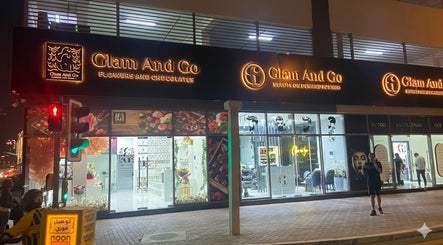 Illuminated facade of Glam & Go Ladies Salon L.L.C in Dubai, Dubai, AE at night.
