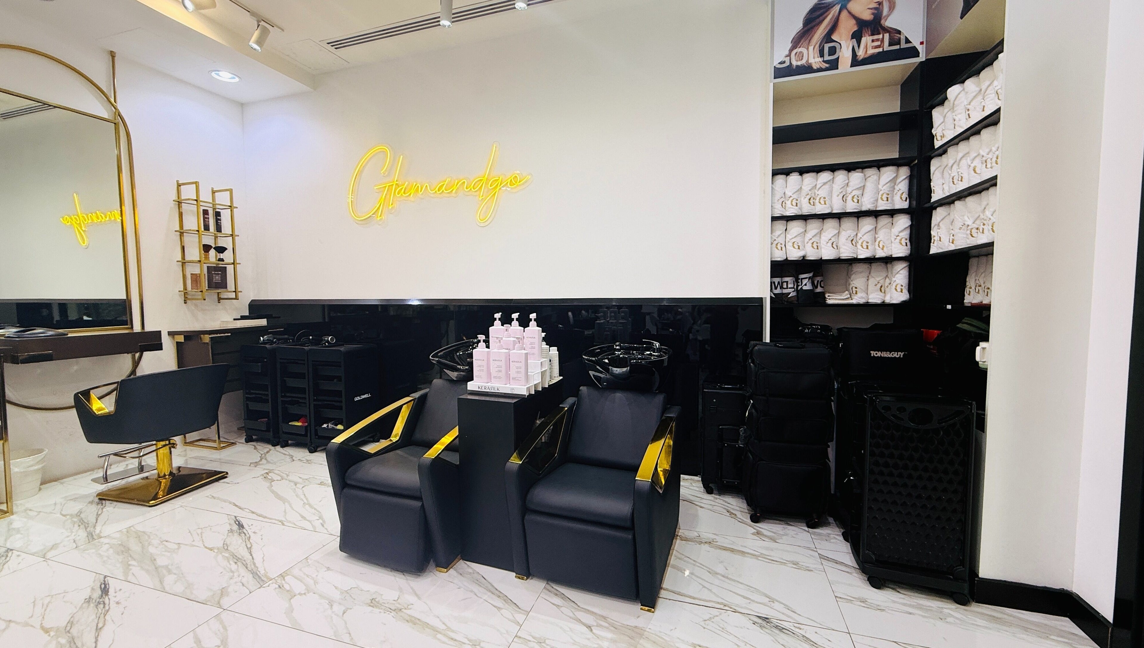 Luxurious interior of Glam & Go Salon JVC, Dubai, Dubai, AE with elegant styling chairs and modern decor.