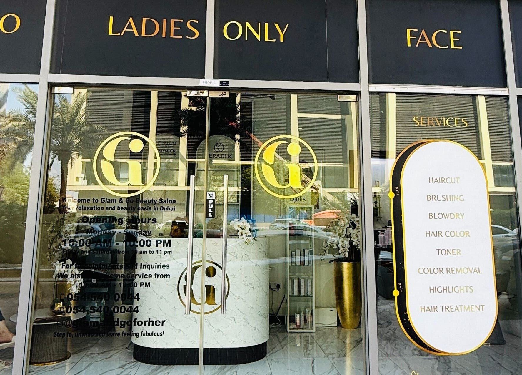 Front entrance of Glam & Go Salon JVC, Dubai, Dubai, AE, showcasing services like haircuts and coloring.