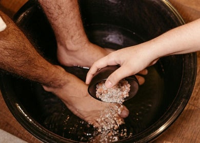 Salt being poured into a foot bath at JY Aromatherapy, Bayan Lepas, Penang, MY for a soothing detox experience.