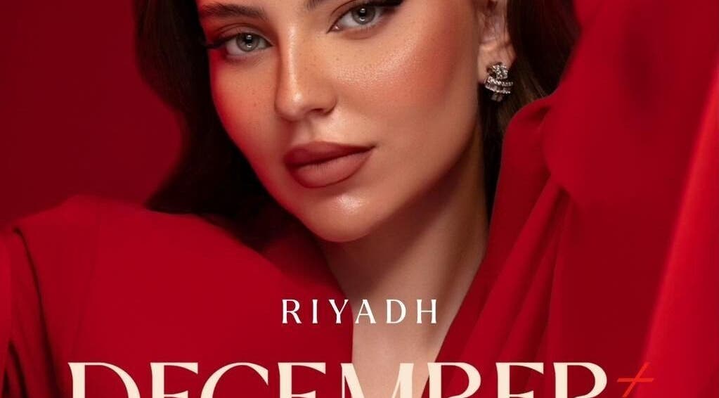 Close-up of a model in vibrant red, showcasing beauty at December Salon & Spa, Riyadh, Riyadh Province, SA.