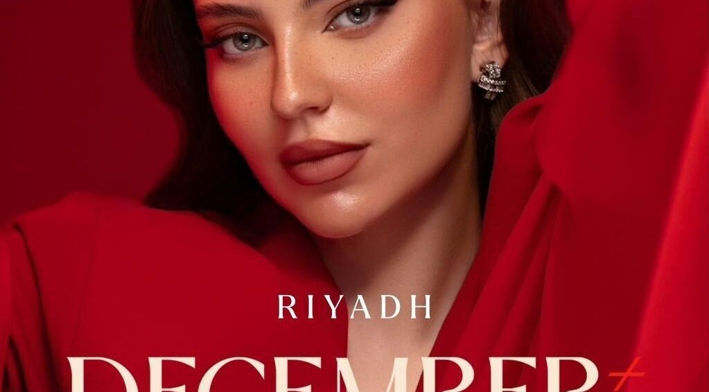 Close-up of a model in vibrant red, showcasing beauty at December Salon & Spa, Riyadh, Riyadh Province, SA.