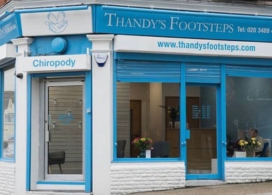 Exterior of Alina N. Sports Massage, Barnet, England, GB featuring a modern blue storefront.