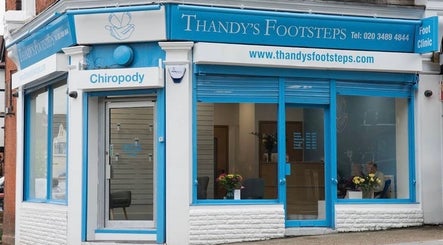 Exterior of Alina N. Sports Massage, Barnet, England, GB featuring a modern blue storefront.