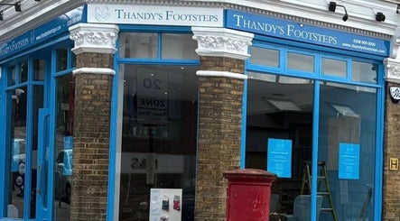 Exterior of Alina N. Sports Massage with blue windows in London, England, GB, reflecting the vibrant city vibe.