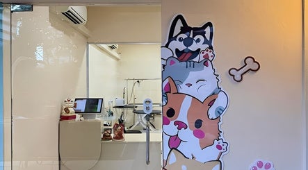 Entrance of CuteSource in Singapore, featuring cute pet-themed decor and welcoming ambience.