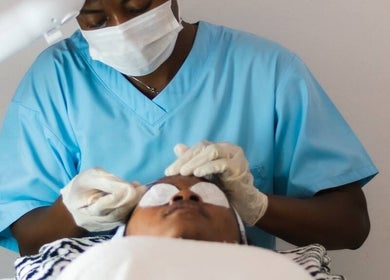 Therapist performing a relaxing facial at Sauna Hub Ghana, Madina, Greater Accra Region, GH.