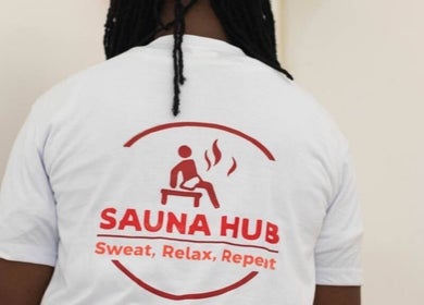 Back view of person wearing Sauna Hub Ghana t-shirt in Madina, Greater Accra Region, GH.