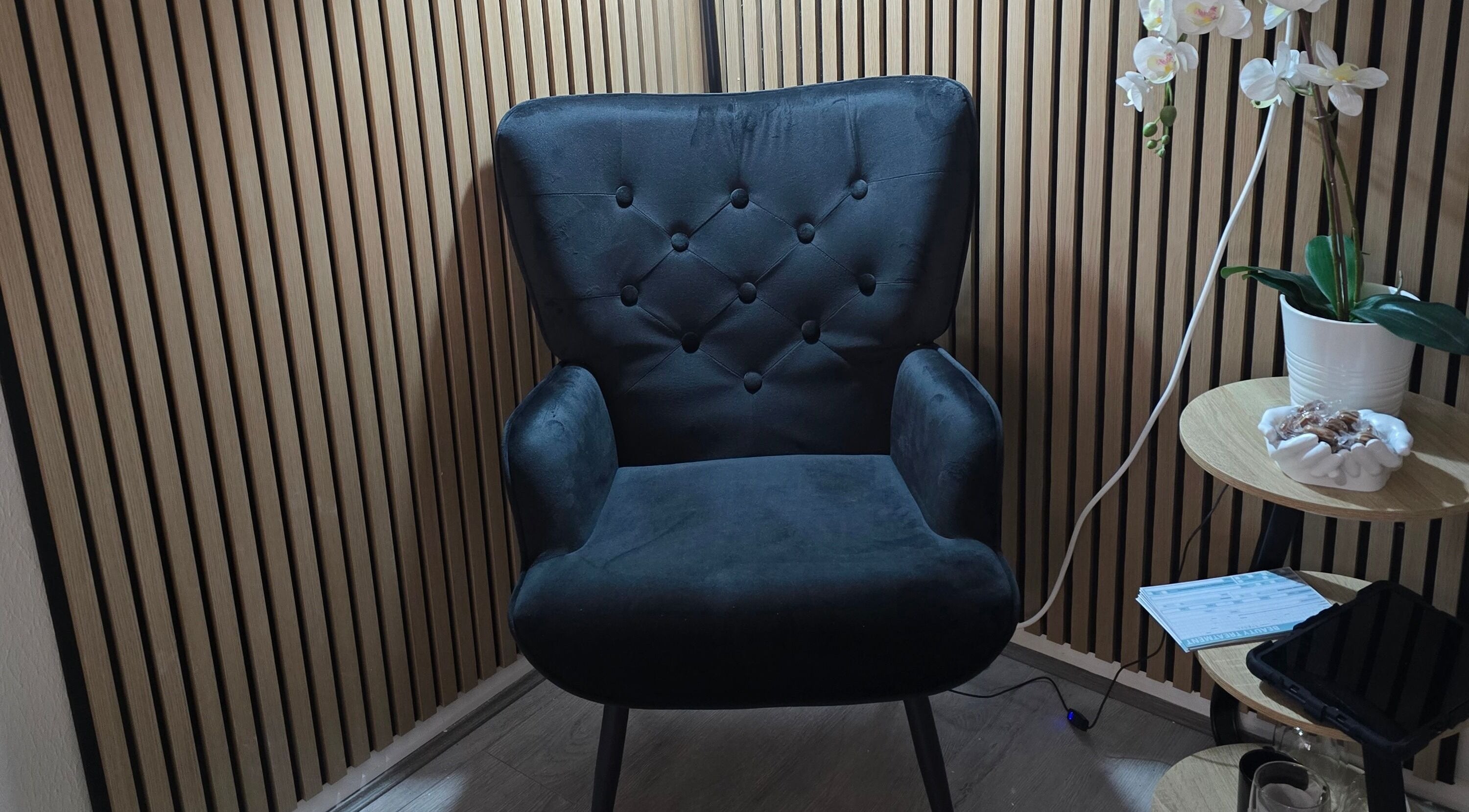 Elegant velvet chair at Face it by Ian, Walton-on-Thames, England, GB, perfect for relaxation.