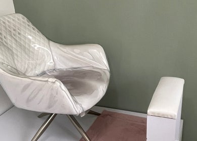 Luxury chair in Pretty Palace by NCM, Willemstad, Curaçao, CW, offering a serene and stylish ambiance.