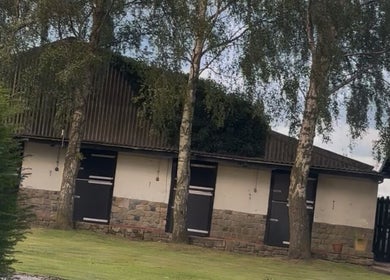 E.N Beauty's serene venue entrance surrounded by lush trees in Preston, England, GB.