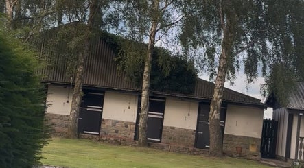 E.N Beauty's serene venue entrance surrounded by lush trees in Preston, England, GB.