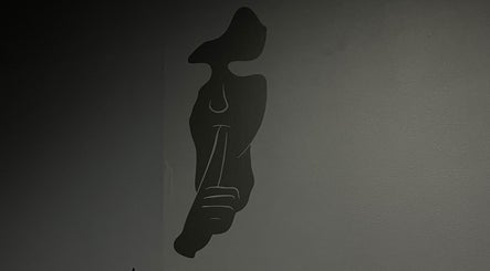 Modern art silhouette on wall at AsrarCutz, Helsinki, Uusimaa, FI.