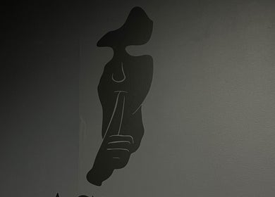 Elegant silhouette artwork at AsrarCutz, enhancing the beauty space in Helsinki, Uusimaa, FI.