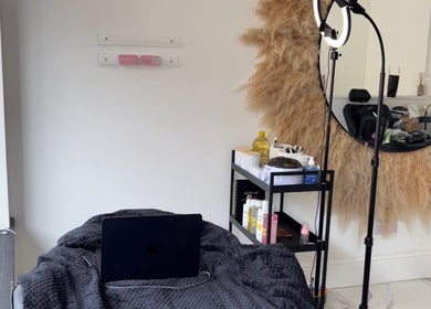 Cozy beauty setup at Noora's Beauty Lab in Edinburgh, Scotland, GB, featuring a mirror and soft lighting.