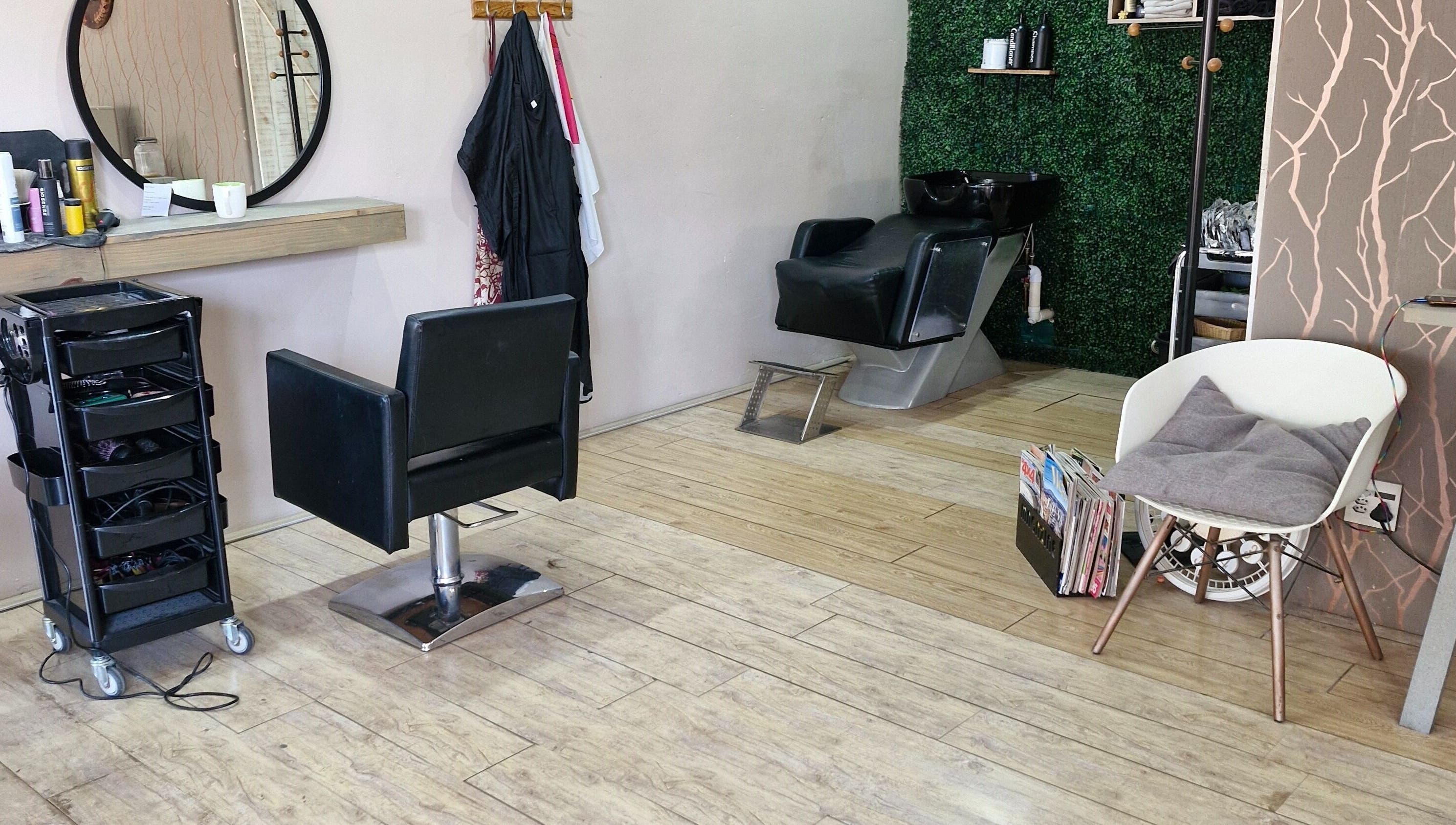 Chic interior of Nuvo Hair salon in Pretoria, Gauteng, ZA showcasing a modern styling chair and wash station.