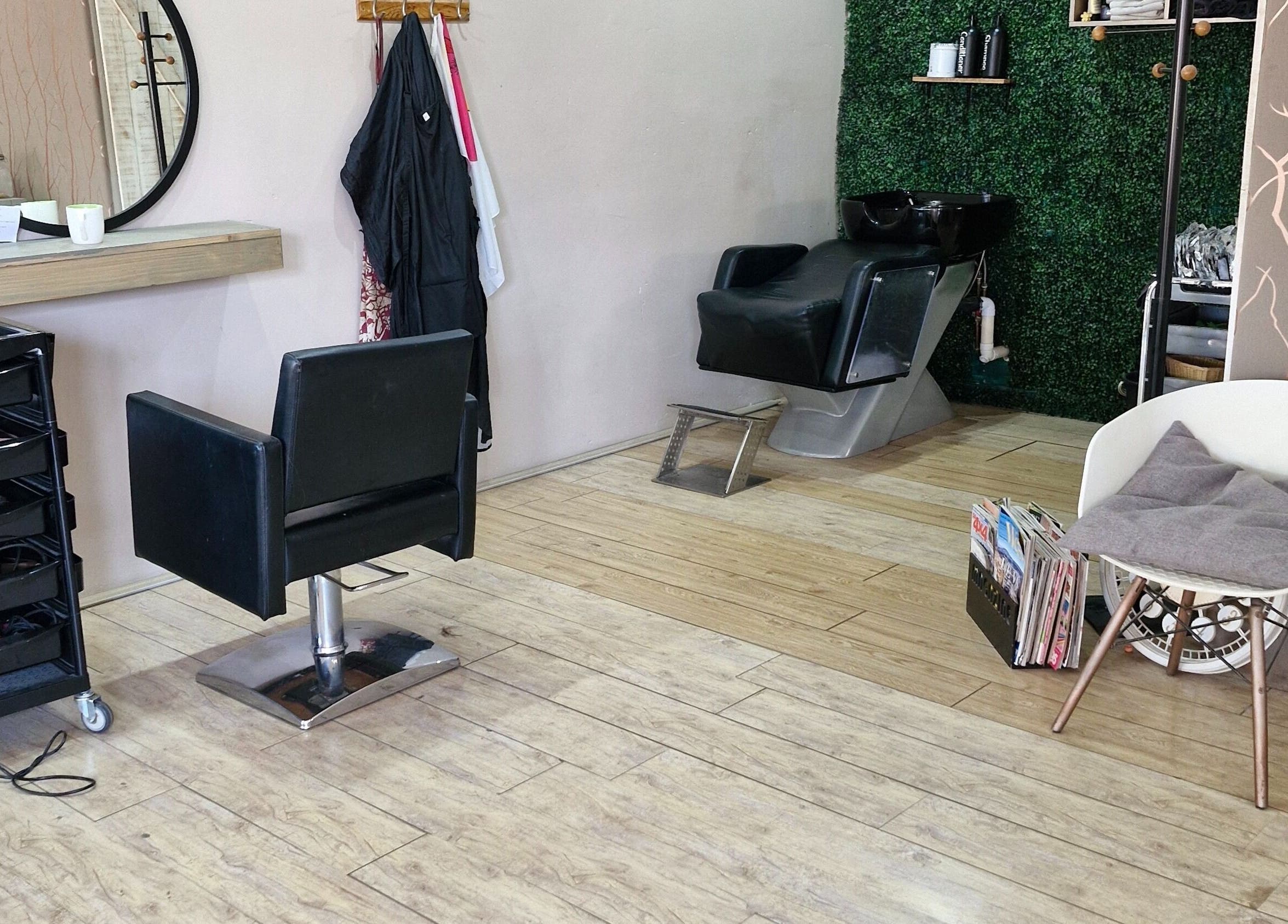 Chic interior of Nuvo Hair salon in Pretoria, Gauteng, ZA showcasing a modern styling chair and wash station.