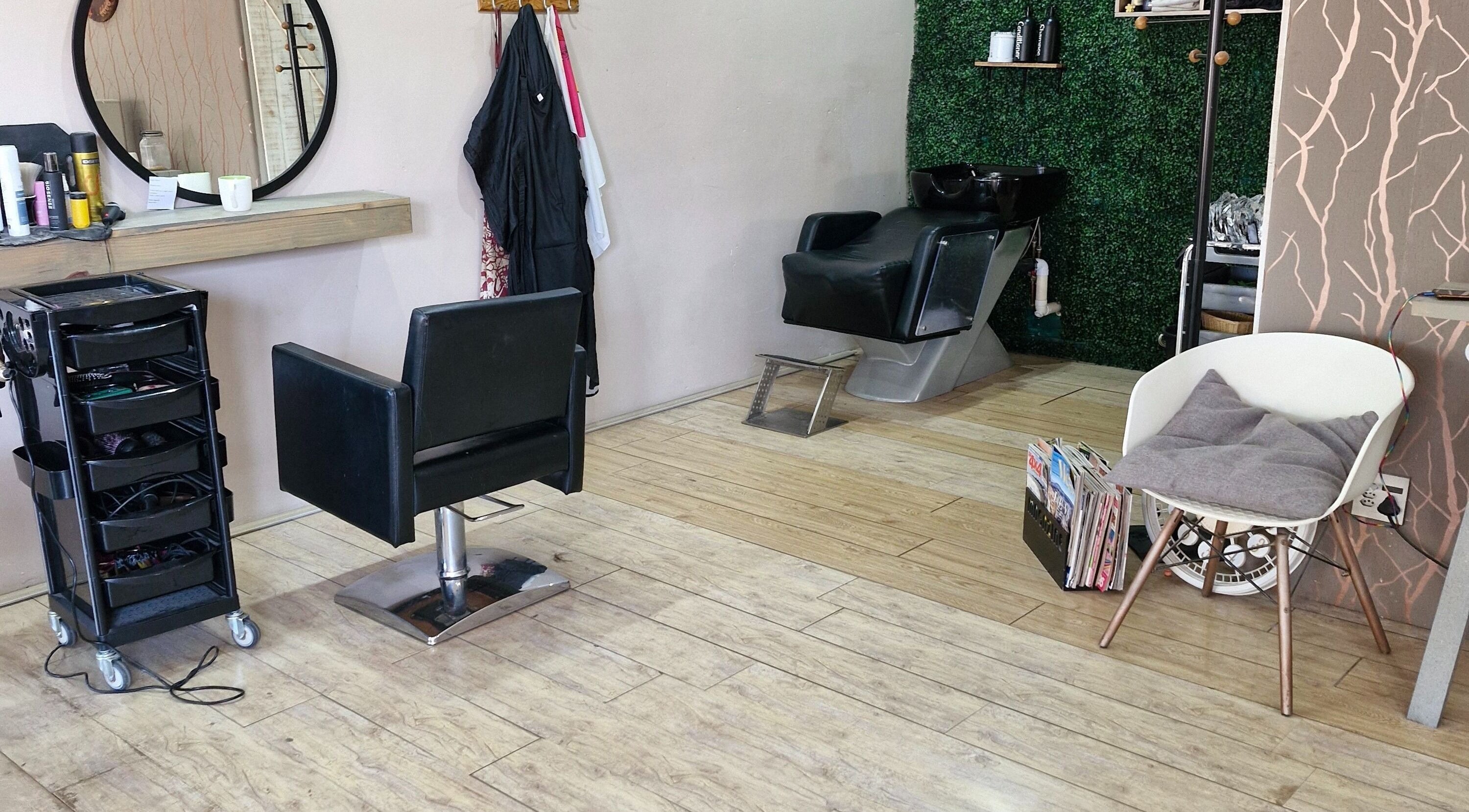 Chic interior of Nuvo Hair salon in Pretoria, Gauteng, ZA showcasing a modern styling chair and wash station.