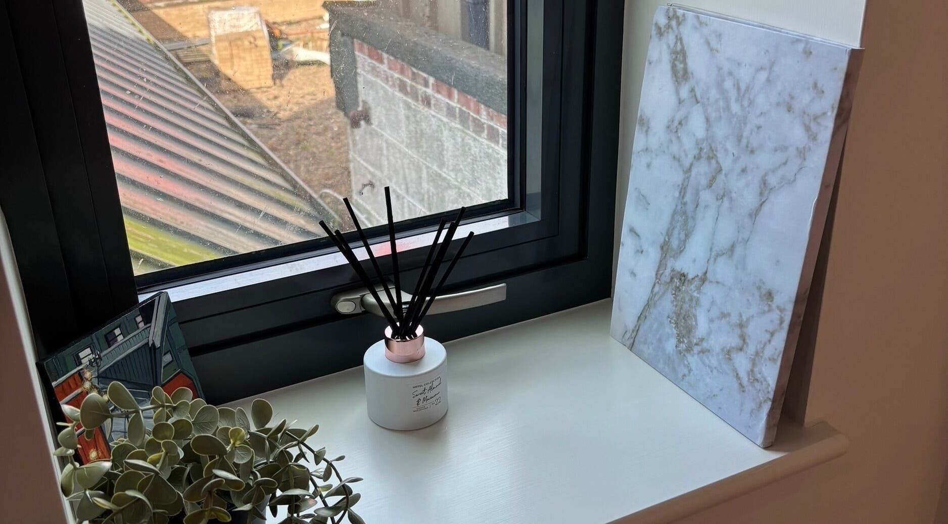Elegant window sill decor with diffuser at SJ Studio, Amble, England, GB.
